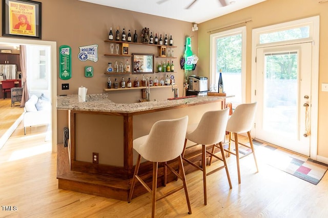5240 Indigo Moon Way, Raleigh, NC 27613 - indoor wet bar featuring light wood finished floors