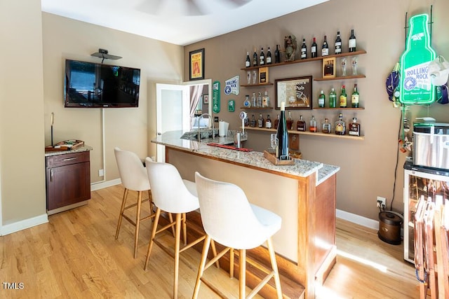 5240 Indigo Moon Way, Raleigh, NC 27613 - indoor bar with light wood-style floors, baseboards, and ceiling fan
