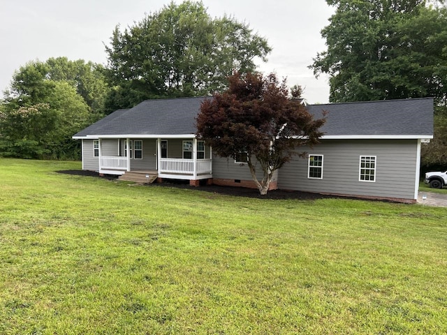 view of front of property with a porch and a front lawn