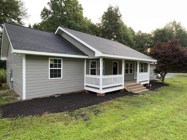 view of front of home with a porch and a front lawn