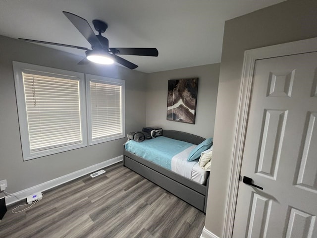 bedroom with light hardwood / wood-style flooring and ceiling fan