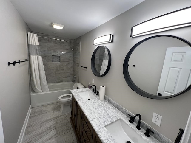 full bathroom featuring vanity, toilet, and shower / bath combo with shower curtain