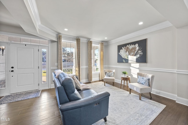 living room featuring ornamental molding and dark hardwood / wood-style flooring