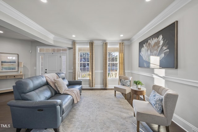 living room featuring hardwood / wood-style floors and crown molding