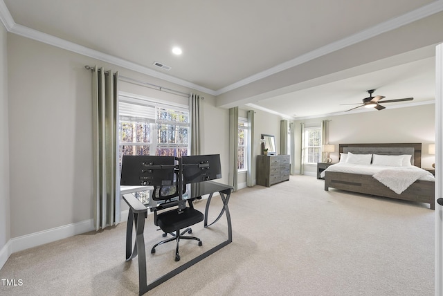 carpeted bedroom with ceiling fan and ornamental molding