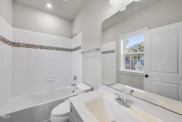 full bathroom featuring shower / bathtub combination, vanity, and toilet