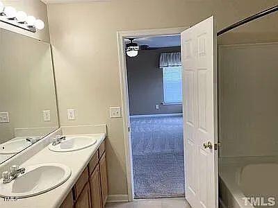 bathroom with vanity and tub / shower combination