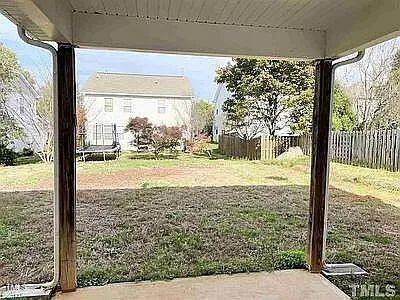 view of yard with a trampoline