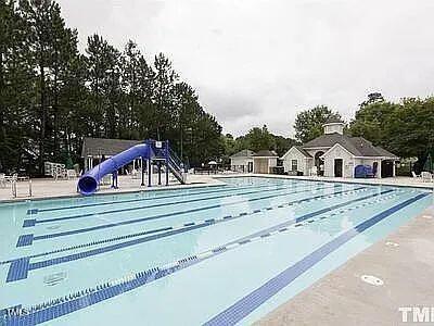 view of pool with a water slide