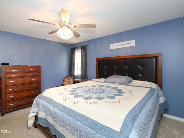 bedroom featuring light colored carpet and ceiling fan