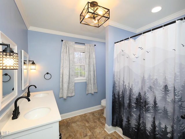 bathroom featuring vanity, toilet, ornamental molding, and a chandelier