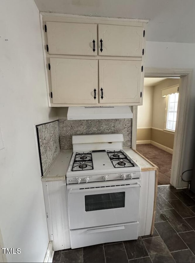 kitchen with exhaust hood, white range with gas stovetop, and white cabinetry