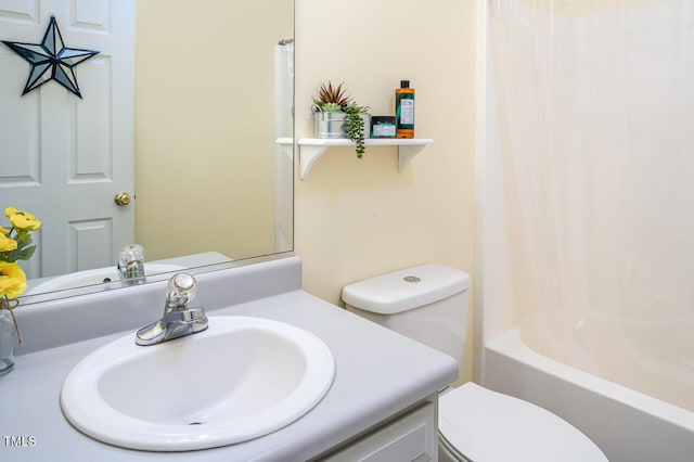 full bathroom featuring vanity, shower / bath combo, and toilet