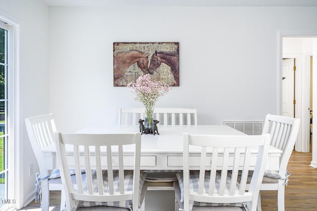 dining area featuring hardwood / wood-style flooring