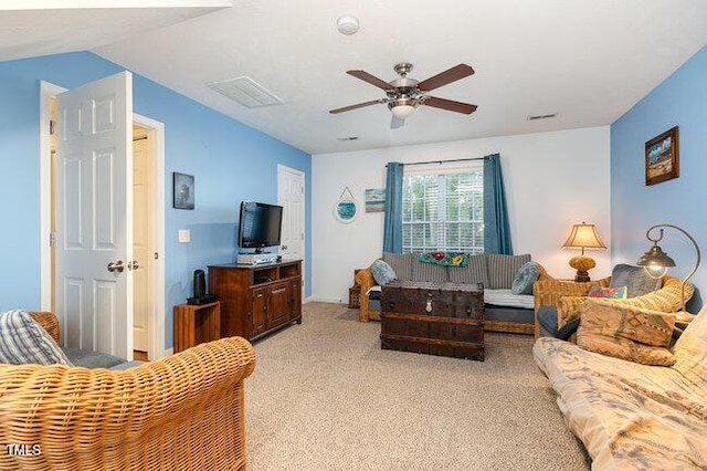 living area featuring light carpet, ceiling fan, and visible vents