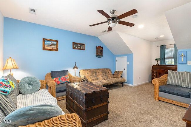 carpeted living room featuring visible vents, vaulted ceiling, baseboards, and ceiling fan