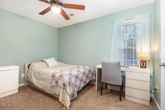 bedroom with a ceiling fan, visible vents, and baseboards