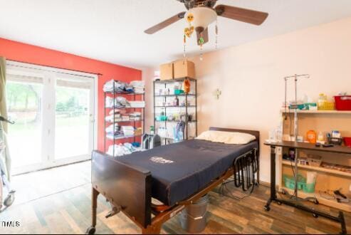 dining space featuring hardwood / wood-style flooring and ceiling fan