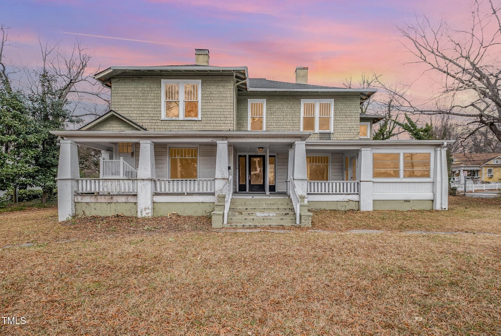 603 W Davis St, Burlington, NC 27215 - view of front of property with a chimney, covered porch, and a front lawn