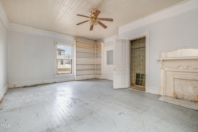 unfurnished living room featuring ceiling fan and wood-type flooring