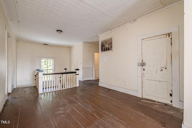 empty room with dark wood-type flooring