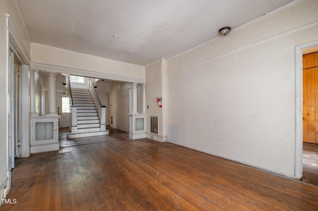 unfurnished living room featuring dark hardwood / wood-style floors