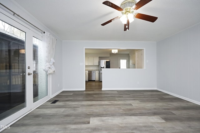 spare room with french doors, hardwood / wood-style flooring, ceiling fan, and crown molding