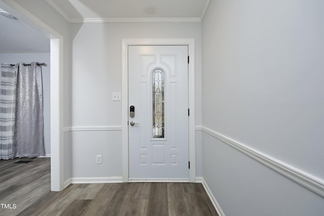 entryway featuring hardwood / wood-style floors, a textured ceiling, and ornamental molding