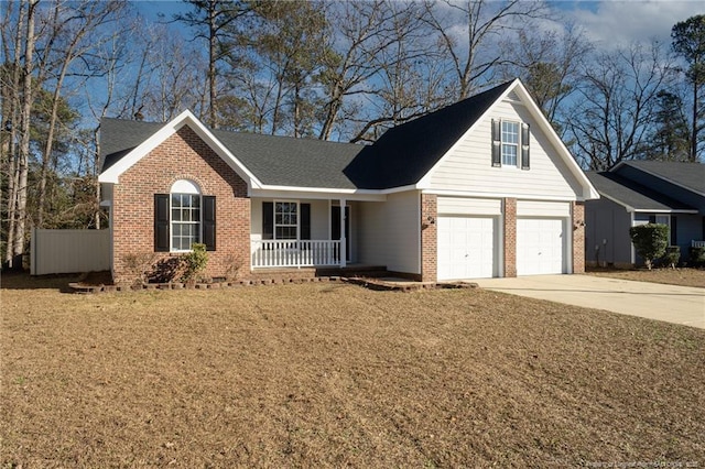 view of front of property with a garage and covered porch