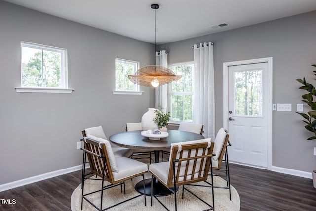 dining area featuring dark hardwood / wood-style flooring