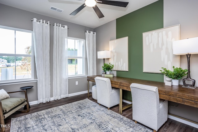 home office with ceiling fan and dark hardwood / wood-style flooring