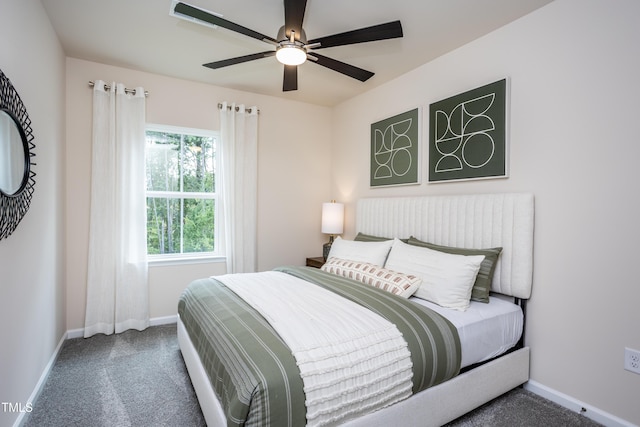 bedroom featuring dark colored carpet and ceiling fan