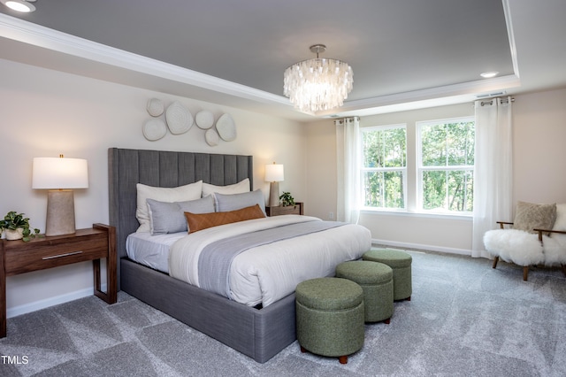 carpeted bedroom with a raised ceiling, a chandelier, and ornamental molding