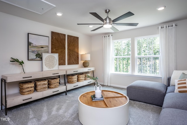 living room with carpet flooring and ceiling fan