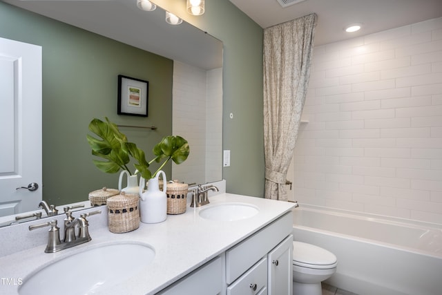 full bathroom with shower / tub combo, vanity, and toilet