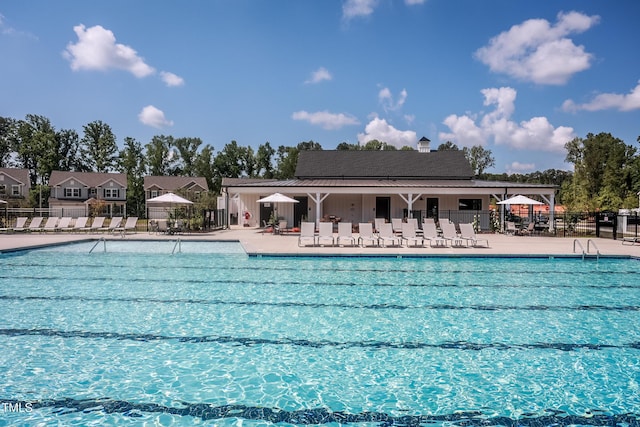 view of swimming pool with a patio