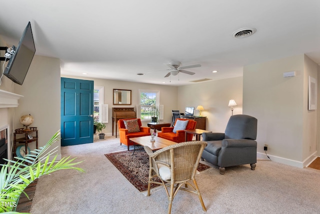 living room featuring ceiling fan and light colored carpet