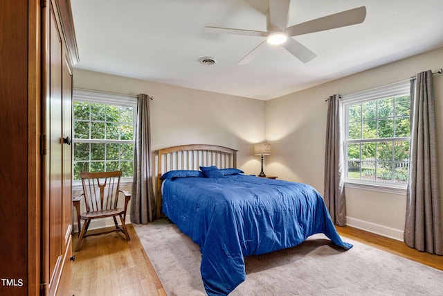 bedroom featuring ceiling fan and hardwood / wood-style flooring