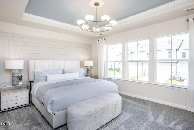 carpeted bedroom with a raised ceiling, a notable chandelier, and crown molding