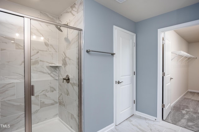 bathroom with a shower with door