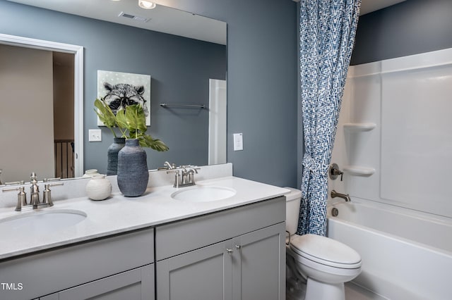 full bathroom featuring shower / bath combo, toilet, and vanity