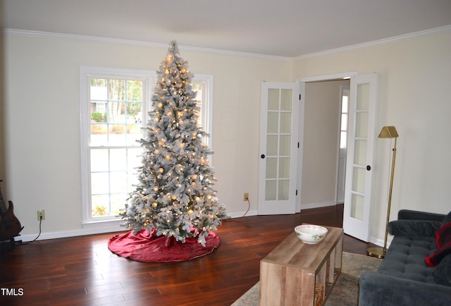 dining space with french doors, dark hardwood / wood-style floors, and crown molding