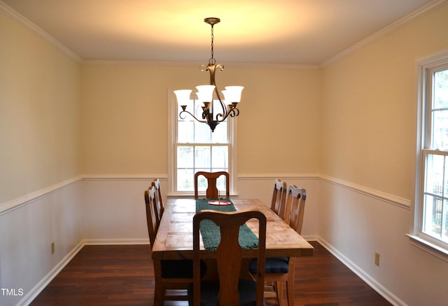 dining area featuring a healthy amount of sunlight, dark hardwood / wood-style flooring, and crown molding