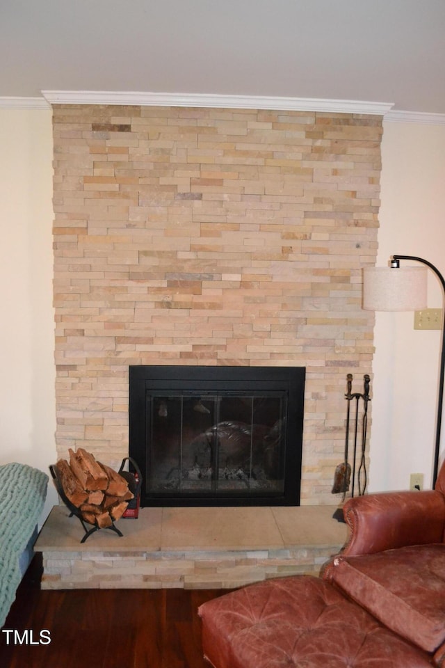 room details featuring a fireplace, hardwood / wood-style flooring, and ornamental molding