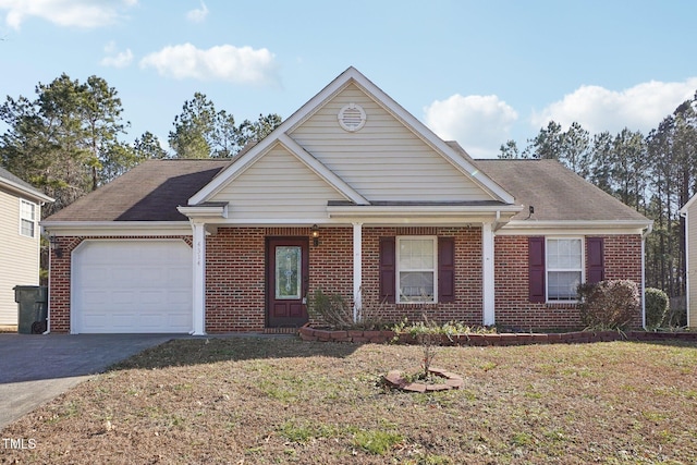 view of front of home with a garage and a front yard