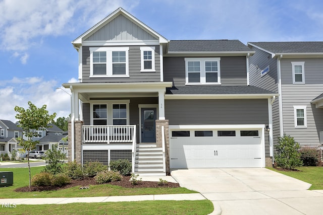 craftsman inspired home featuring a porch and a garage