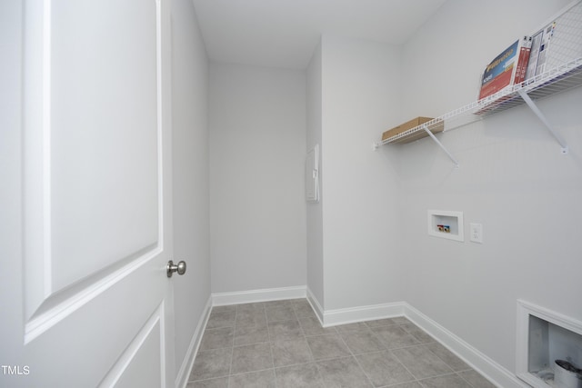 laundry area with a fireplace and hookup for a washing machine