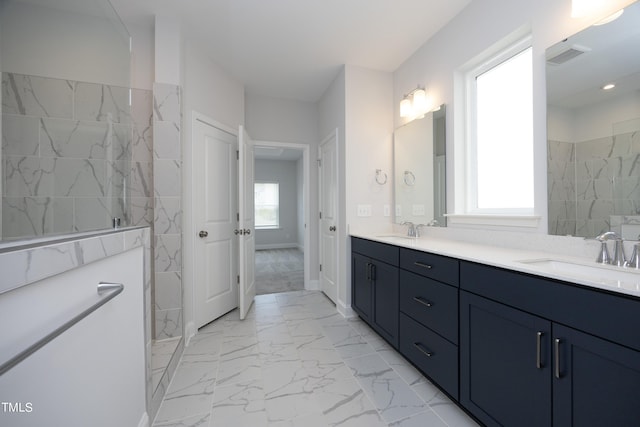 bathroom featuring vanity and a tile shower