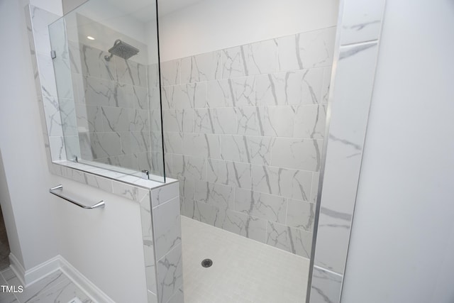 bathroom with tiled shower