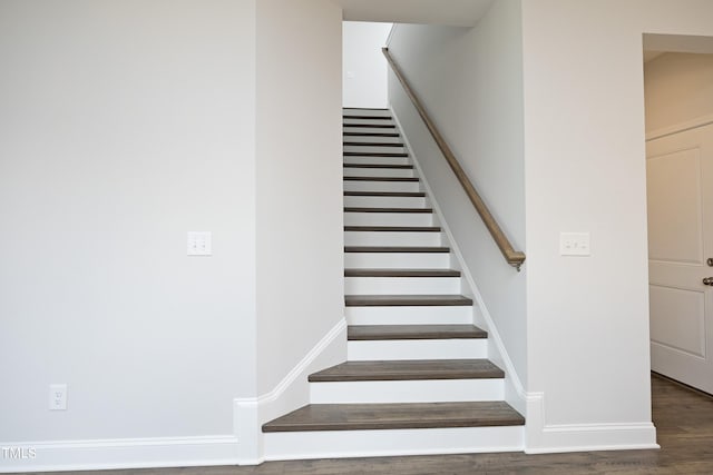 stairs with wood-type flooring